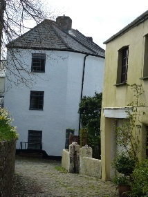 Buildings on a narrow pathway in front of South Molton church.  